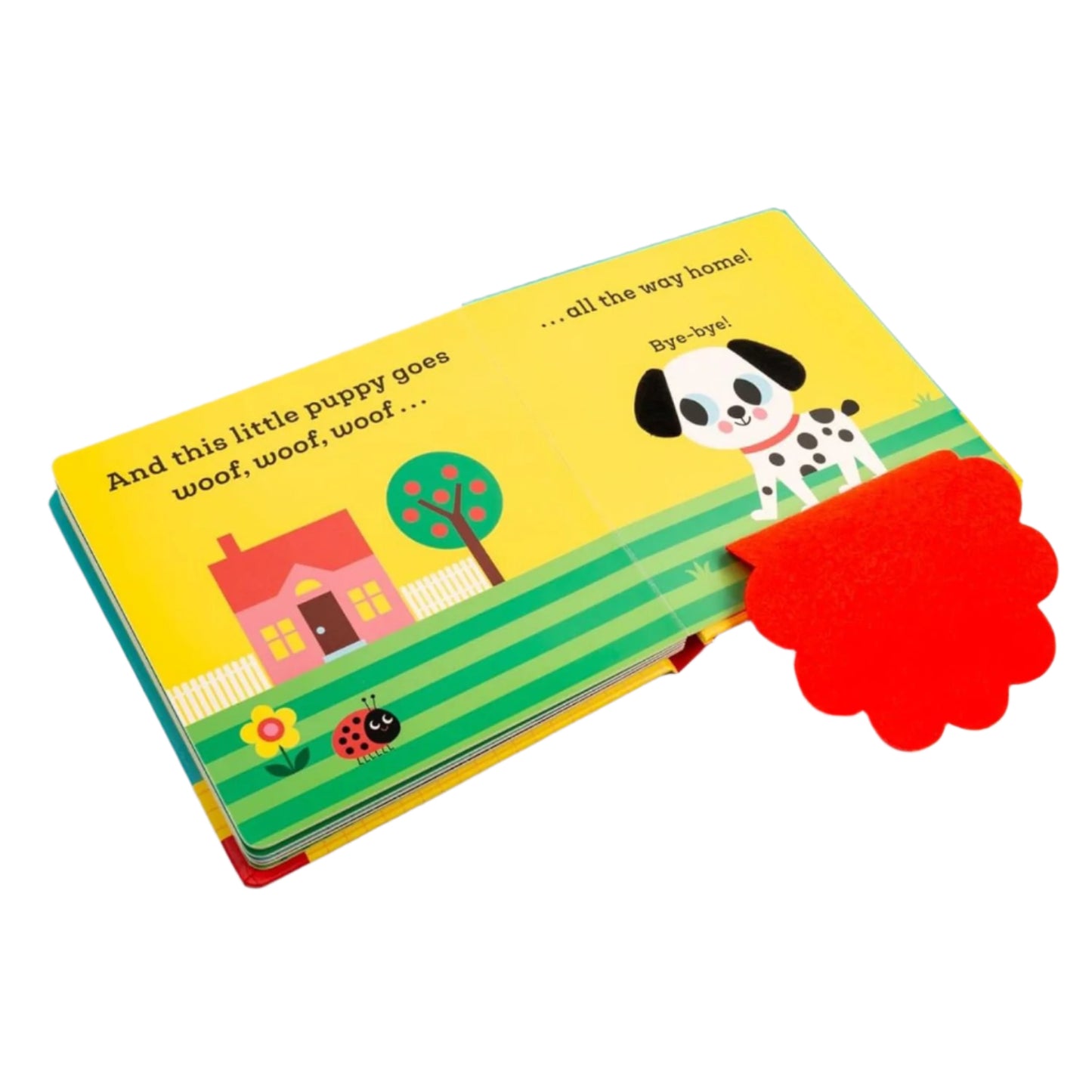 Children's book with a colorful cover featuring a dog, house, and tree on a white background