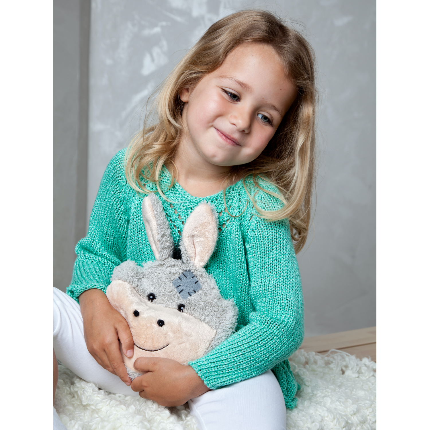 Warming Pillow for Young Children | Donkey | Cherry Stones | Girl with Warming Pillow | BeoVERDE.ie