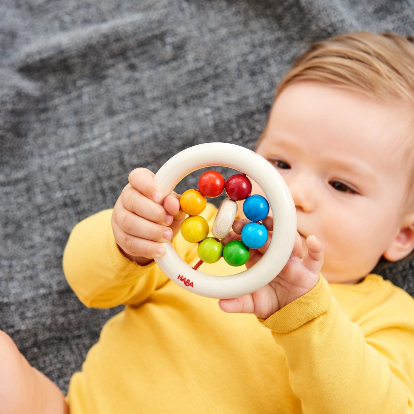 Rainbow Balls | Clutching Toy | Baby’s First Wooden Toy | HABA | Lifestyle: Baby with Clutching Toy | BeoVERDE.ie