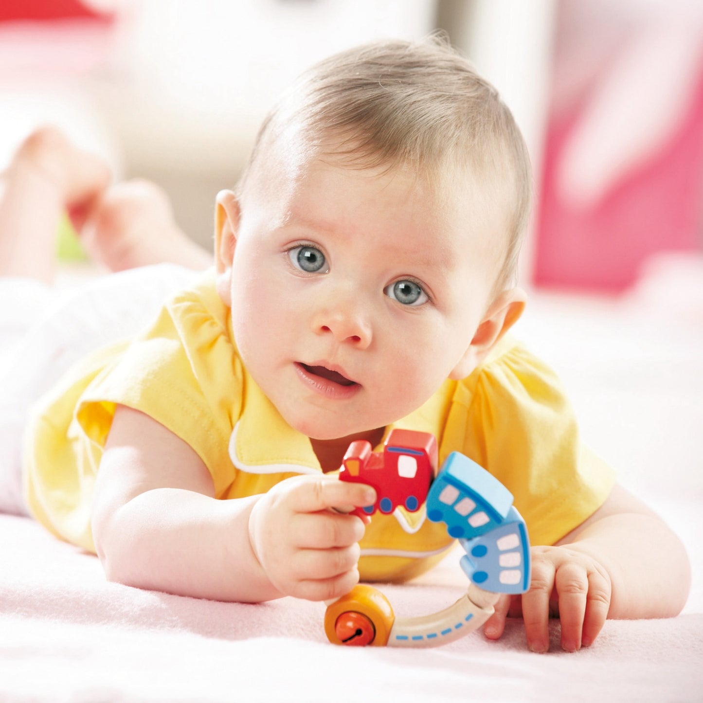 Train | Wooden Clutching Toy | HABA | Lifestyle: Baby with Clutching Toy in Hand | BeoVERDE.ie