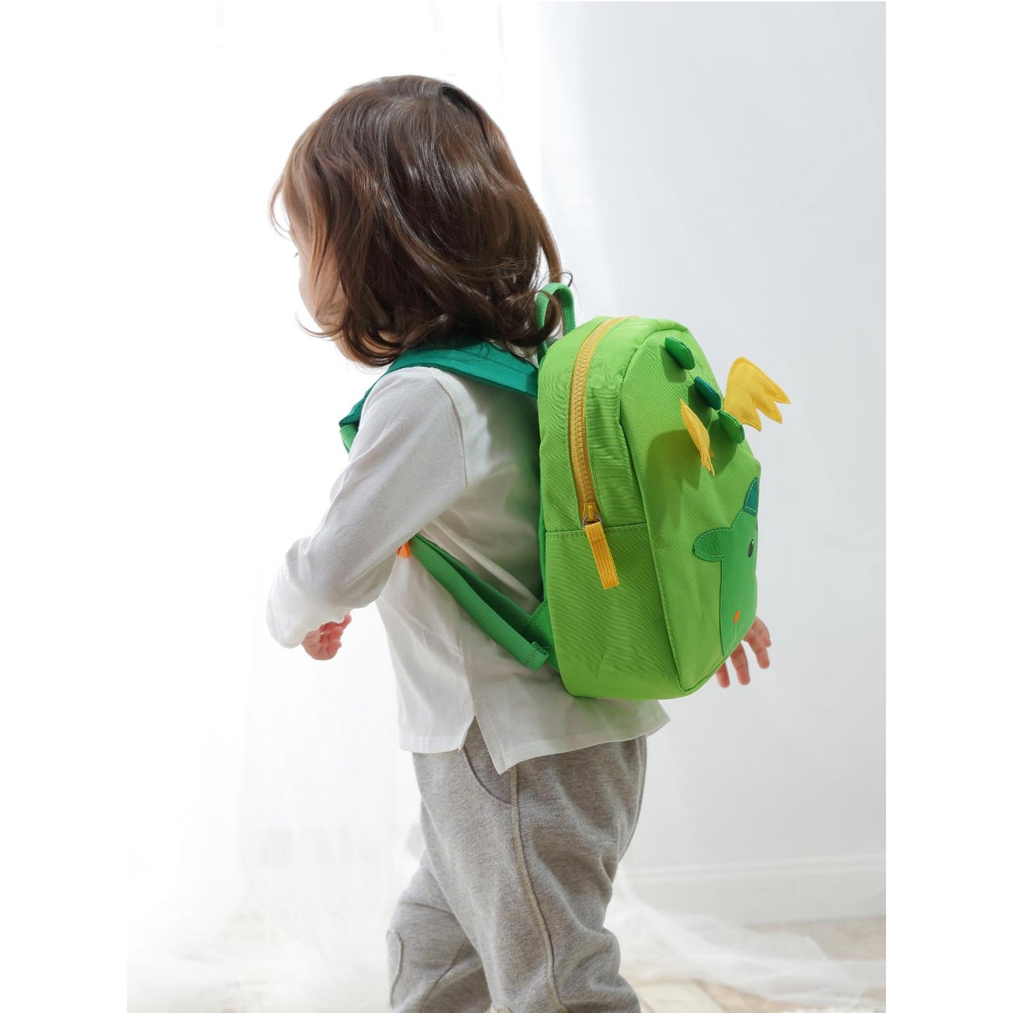 Sigikid Little Dragon Toddler Backpack | Kid’s Backpack for Creche, Nursery & School | Lifestyle: Girl wearing little dragon backpack | BeoVERDE.ie