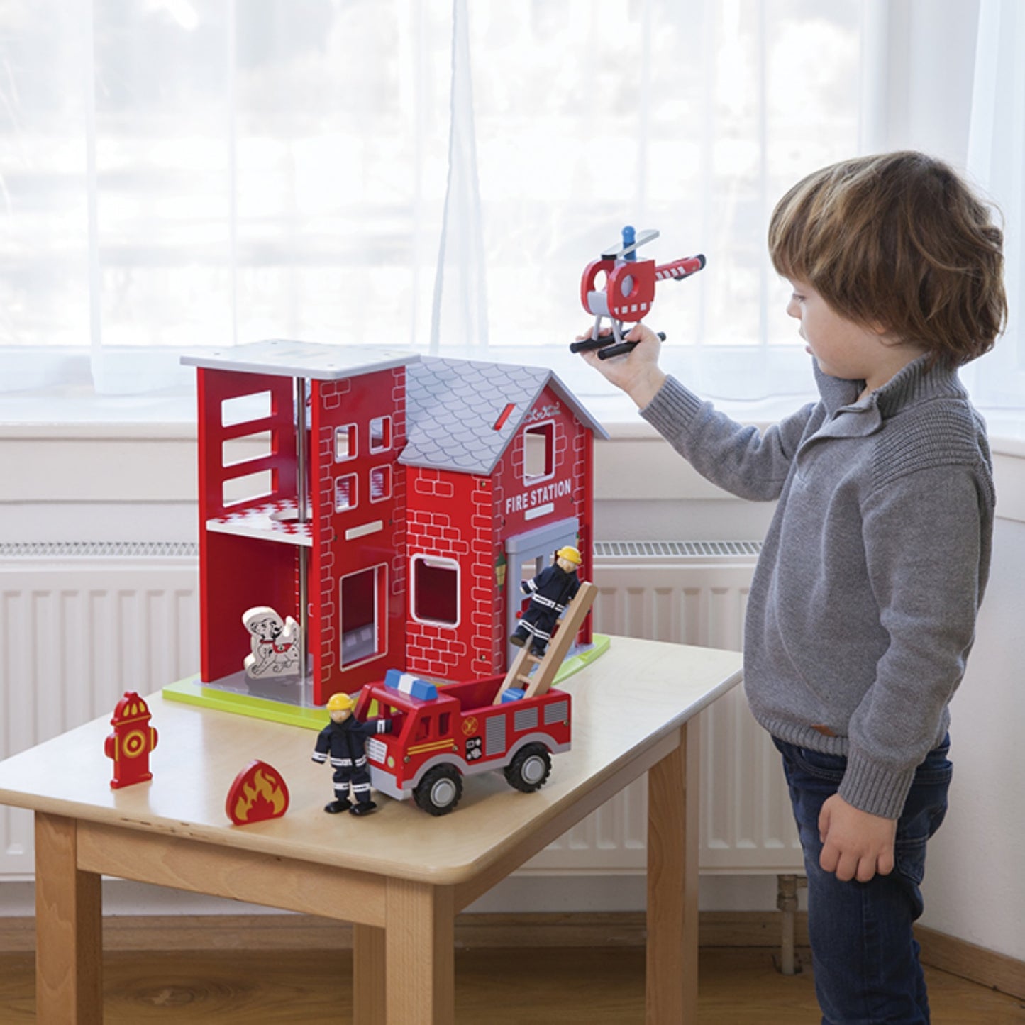 New Classic Wooden Toy Fire Station Play Set | Imaginative Play Toys | Lifestyle – Boy Playing | BeoVERDE.ie