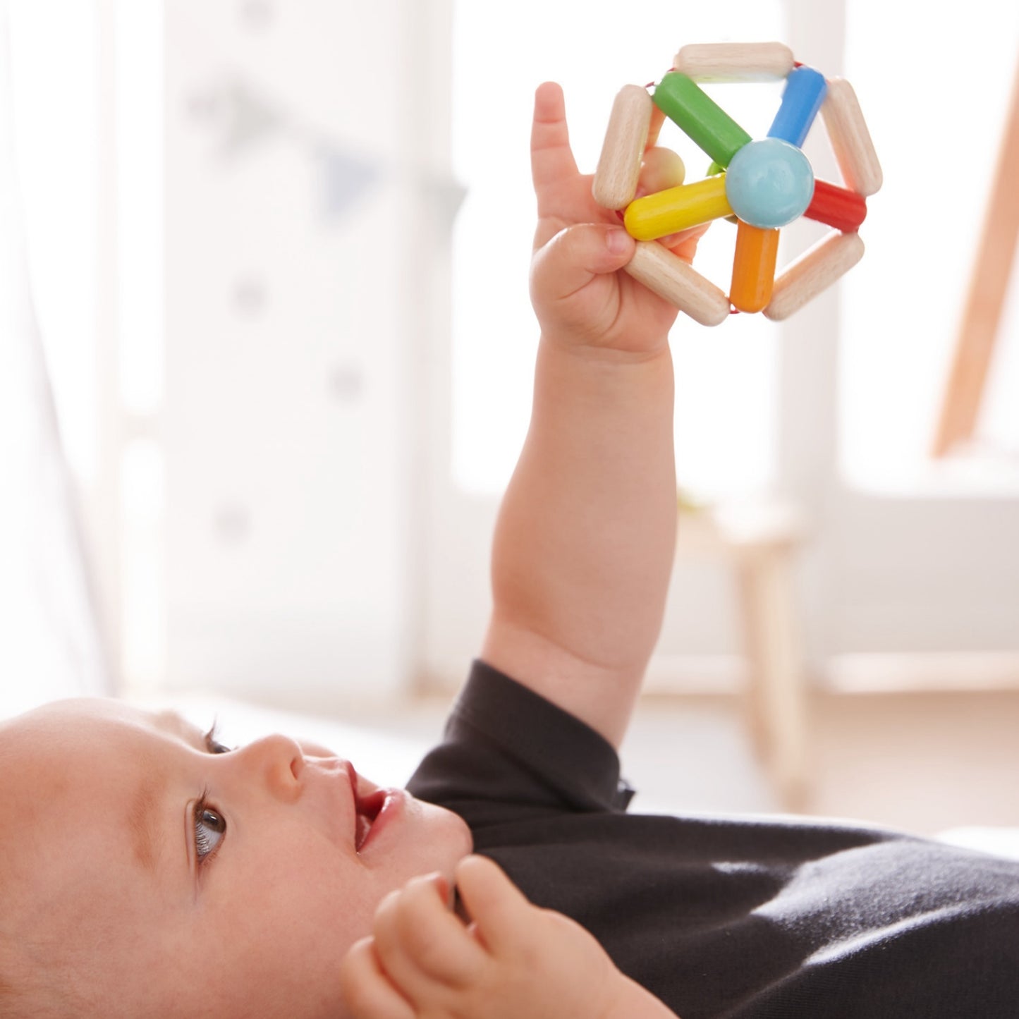 Colour Carousel | Clutching Toy | Baby’s First Wooden Toy | HABA | Lifestyle: Baby Holding Clutching Toy | BeoVERDE.ie