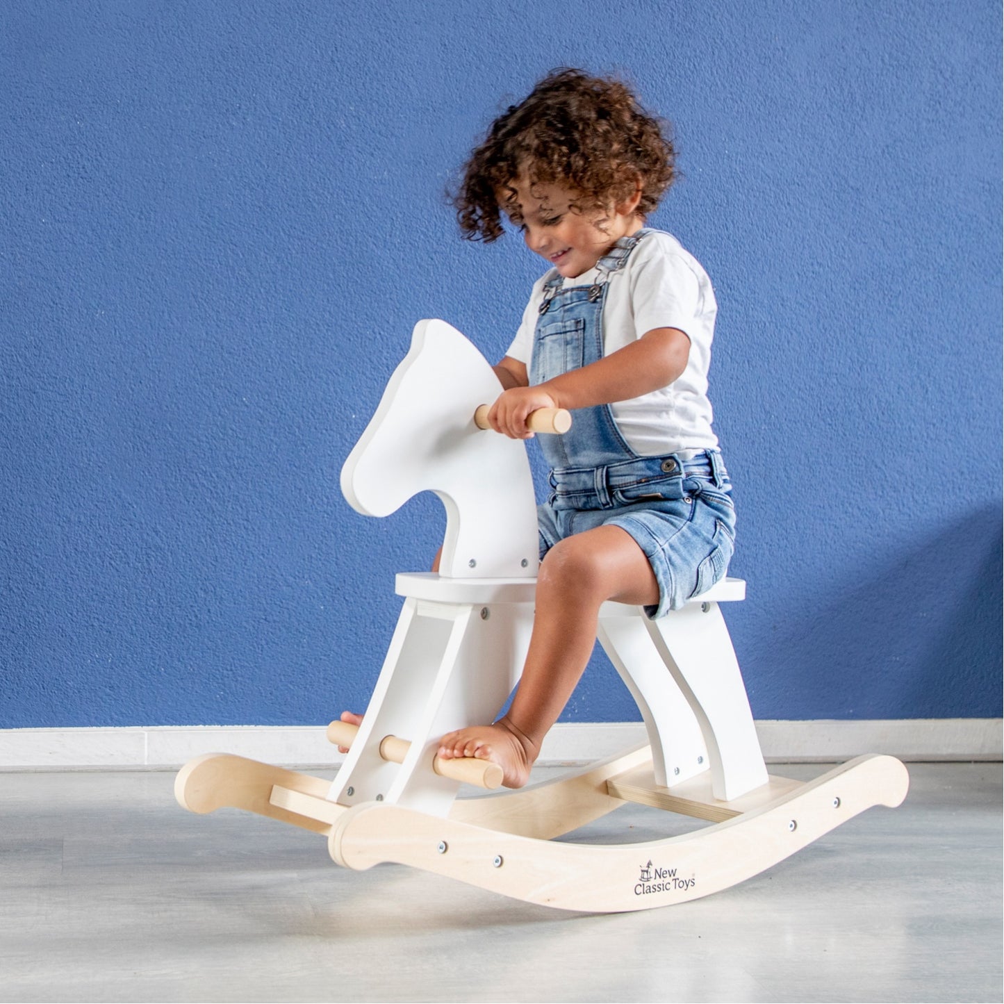 New Classic Toys Wooden Rocking Horse | White | Toddler Activity Wooden Toy | Lifestyle – Child Riding Horse | BeoVERDE Ireland