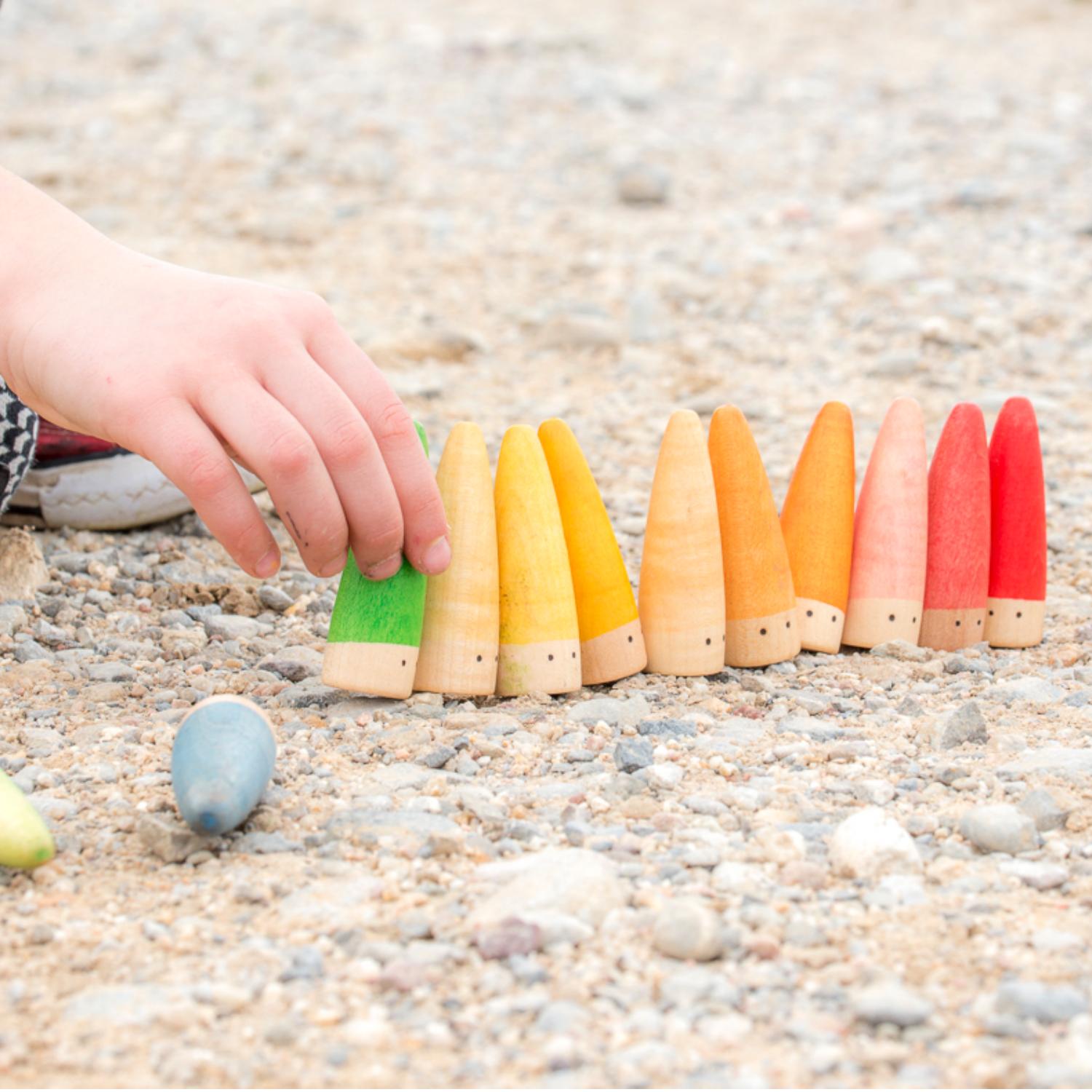 Grapat 18 Sticks | Wooden Toys | Open-Ended Play | Lifestyle: Girl Playing Outside | BeoVERDE.ie