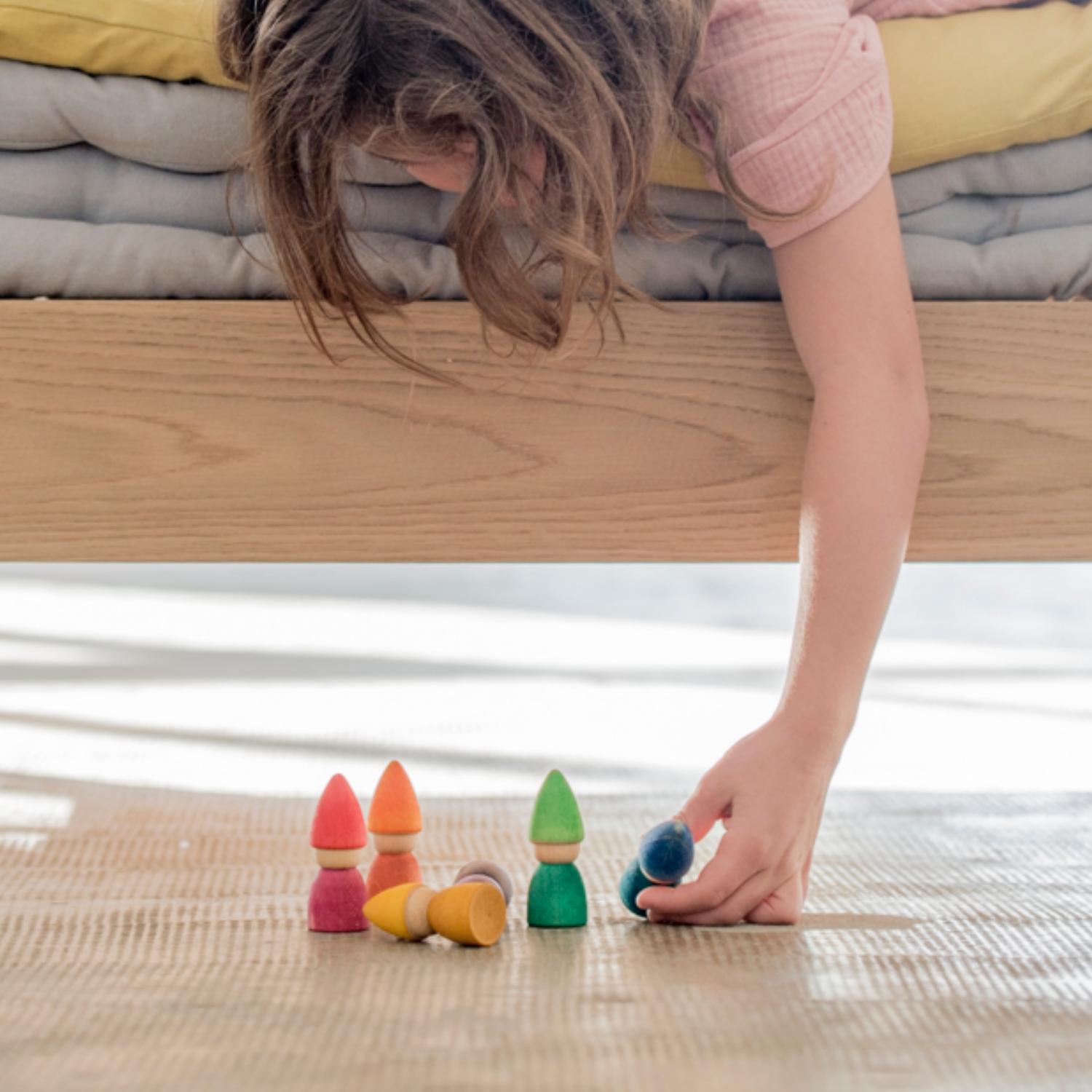 Grapat Rainbow Tomtens | Wooden Toys | Open-Ended Play Set | Lifestyle: Girl Playing Under Bed | BeoVERDE.ie