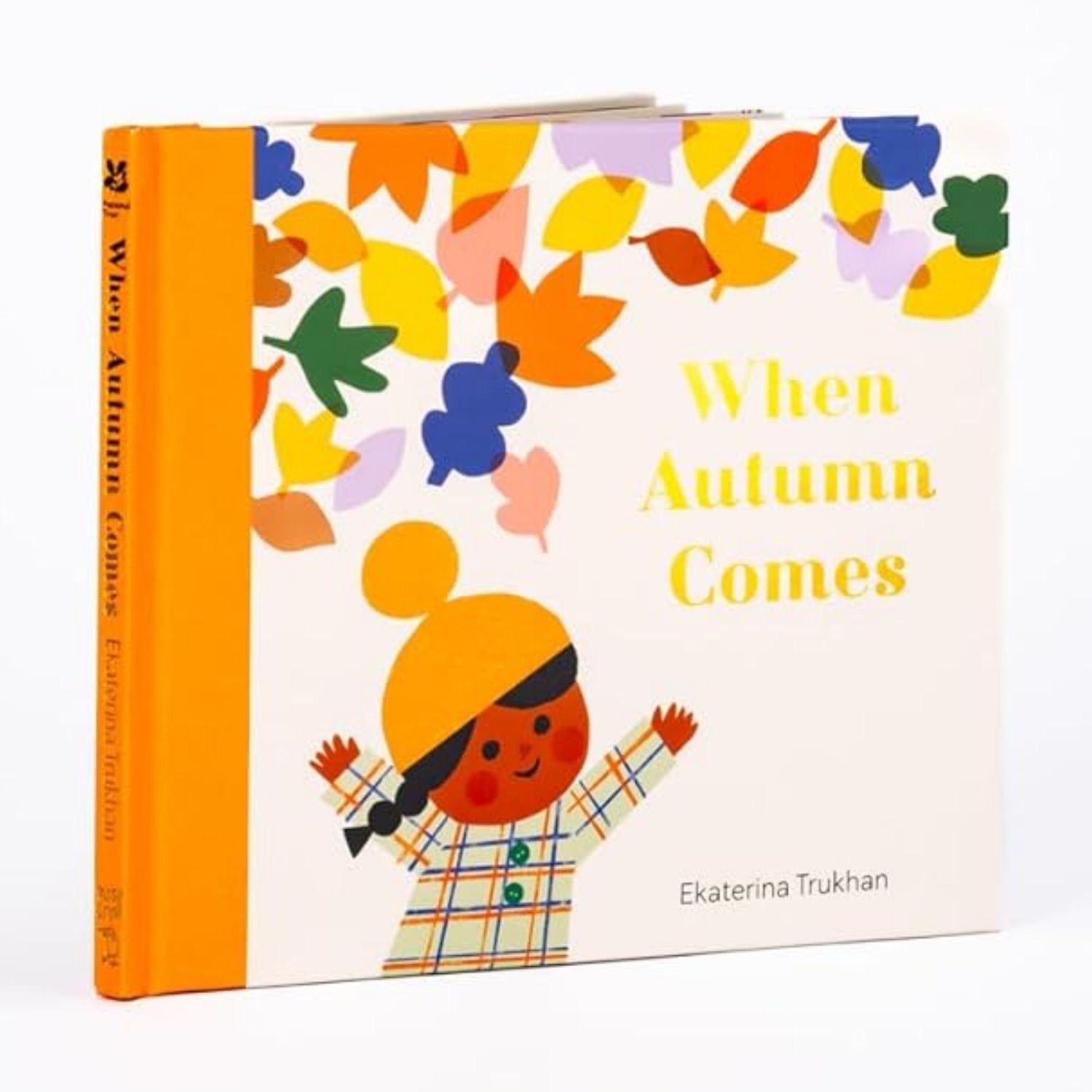 Children's book titled 'When Autumn Comes' with colorful autumn leaves and a child illustration on the cover.