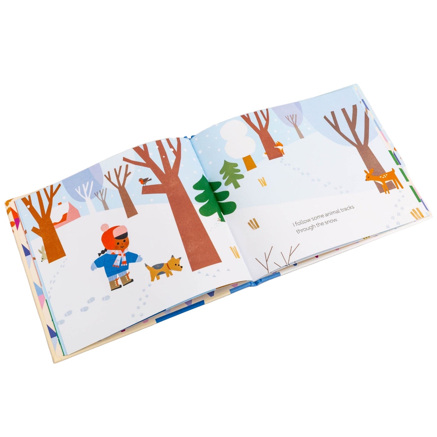 Children's book open to a page with winter-themed illustrations on a white background