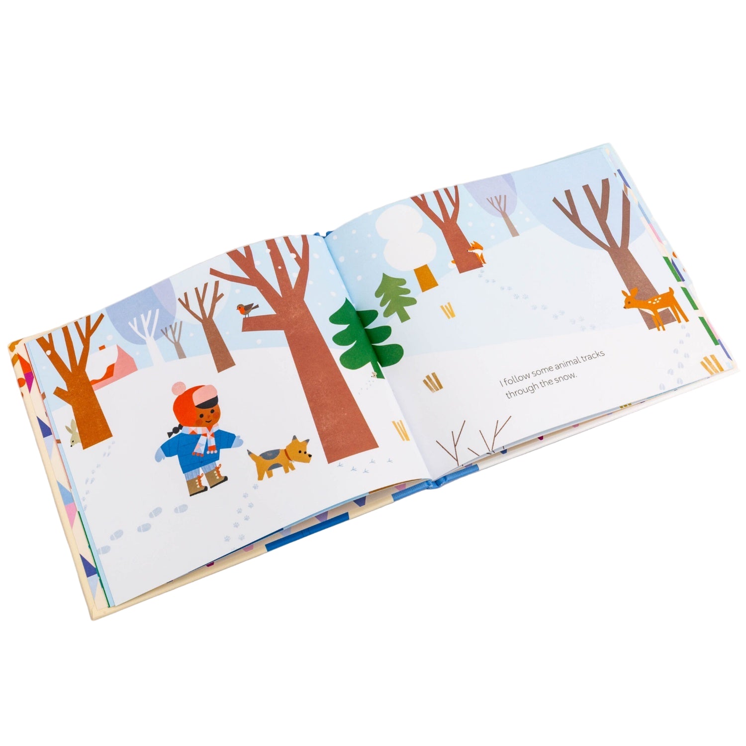 Children's book open to a page with winter-themed illustrations on a white background