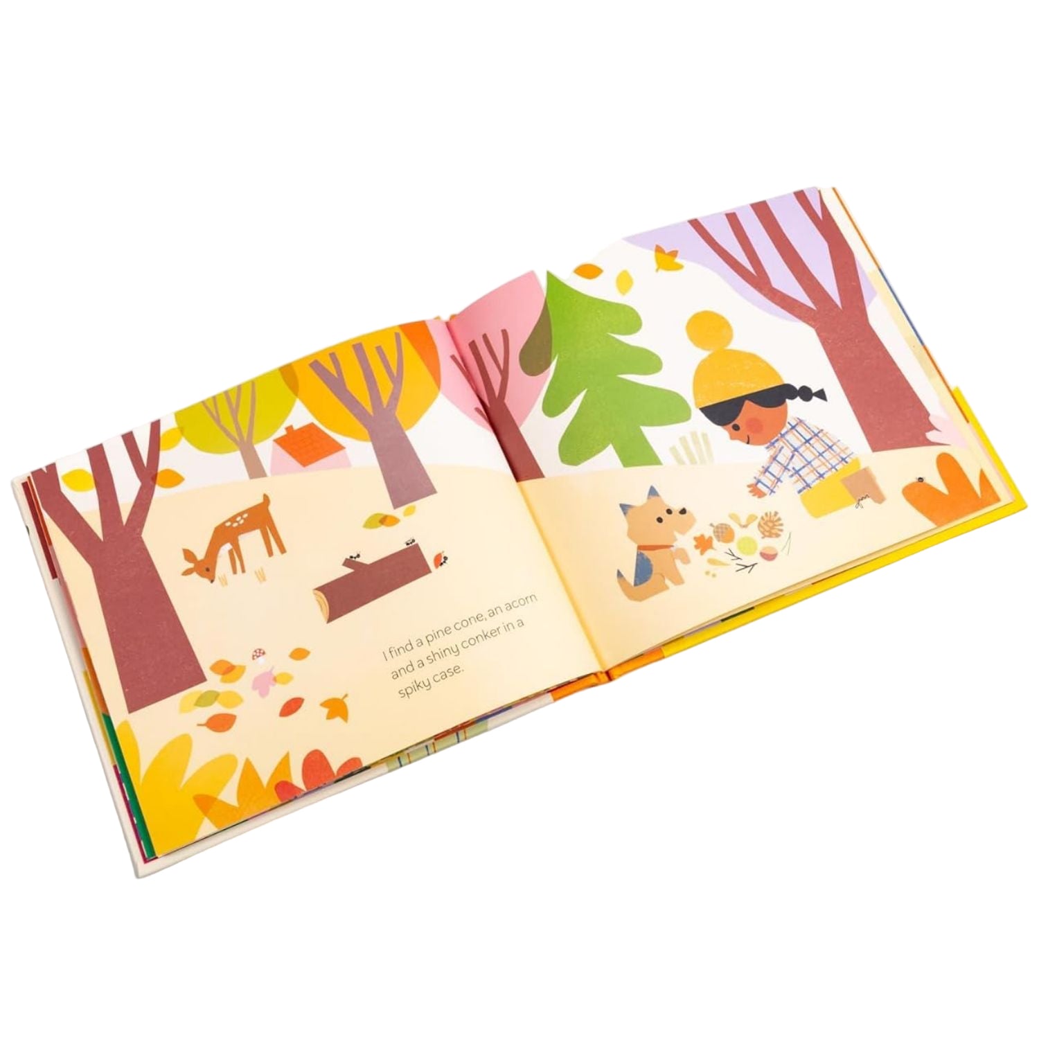 Children's book open to a page with illustrations of trees, animals, and a child in a forest setting.