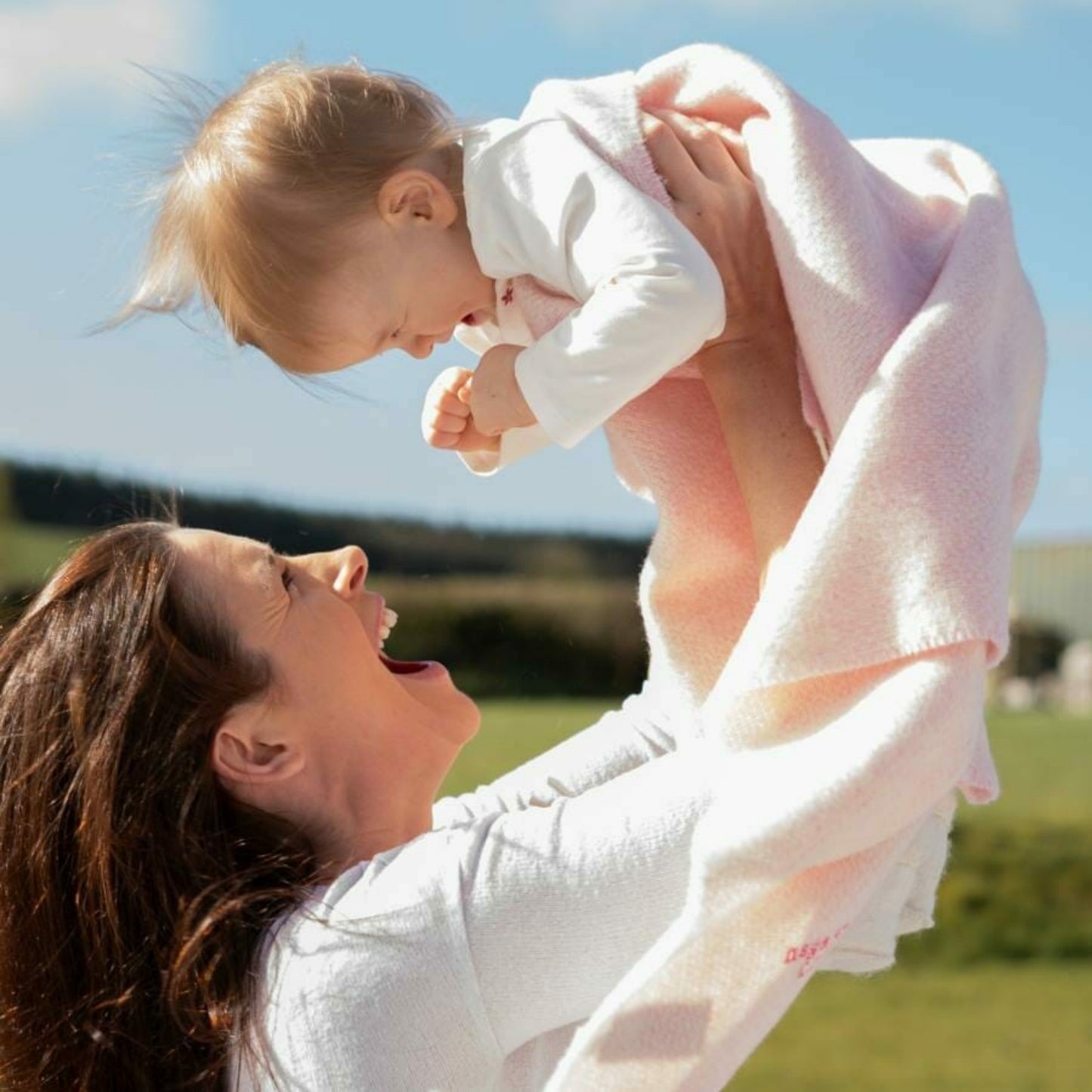 John Hanly Irish Cashmere Baby Blanket | Baby Pink Herringbone Pattern | Cashmere Blanket | Lifestyle: Mother with Baby | BeoVERDE Ireland
