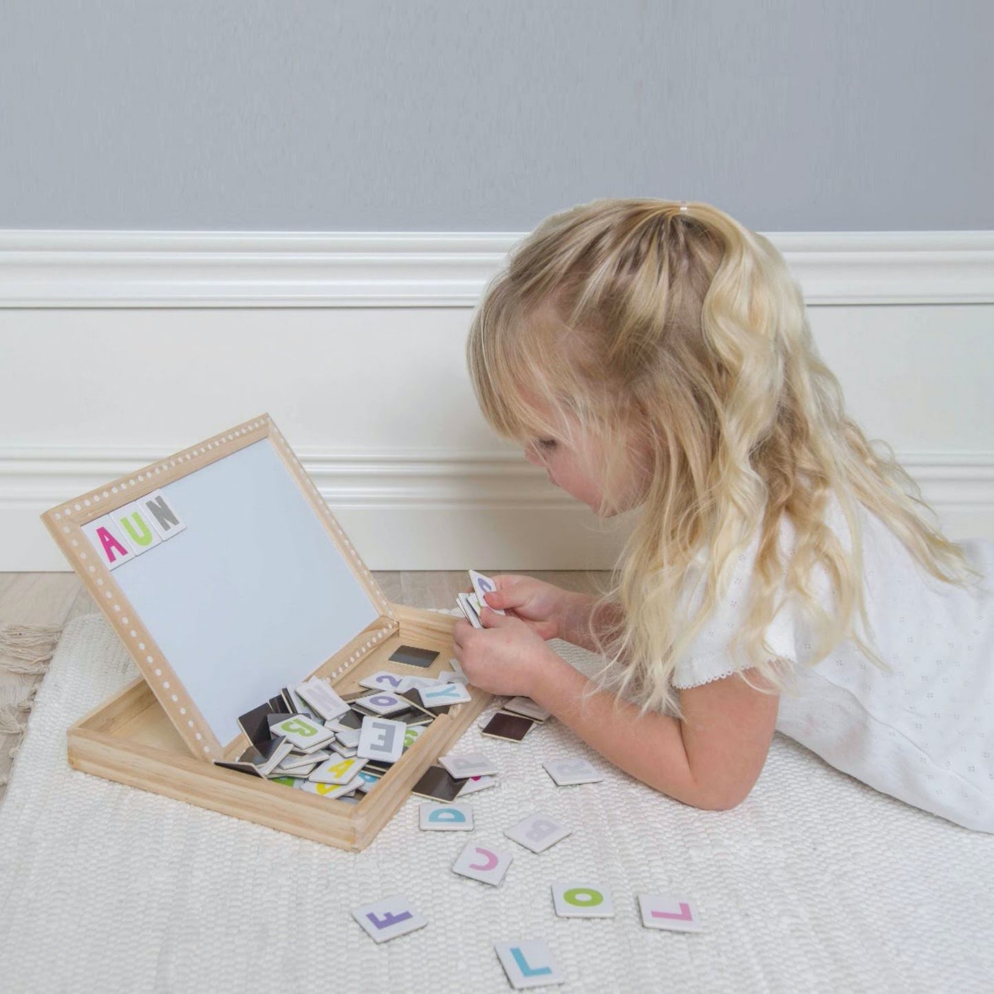 JaBaDaBaDo Magnetic Letters & Numbers Board | Wooden Educational Toy | Girl Playing – Close-Up | BeoVERDE.ie
