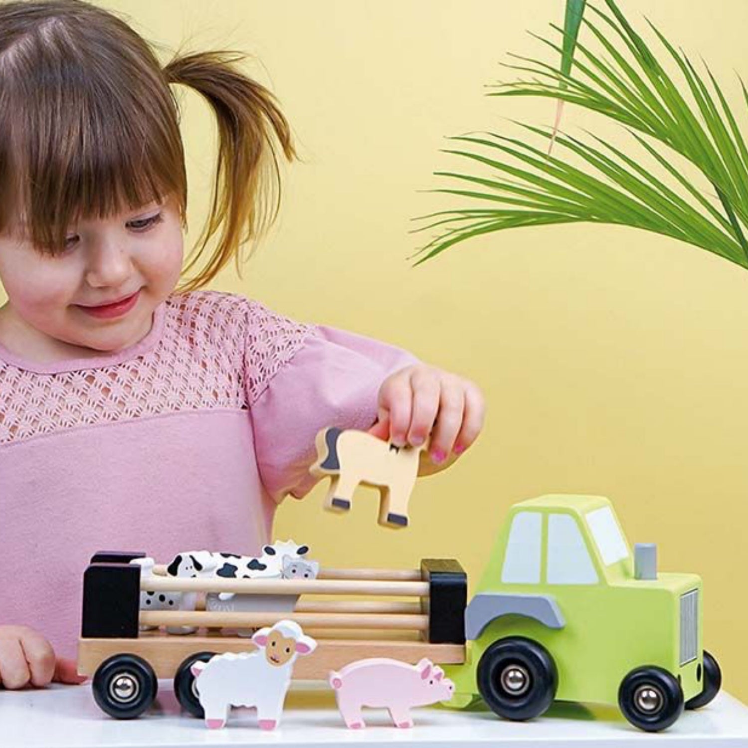 JaBaDaBaDo Farm Tractor | Wooden Imaginative Play Toy | Side View – Girl Playing | BeoVERDE.ie