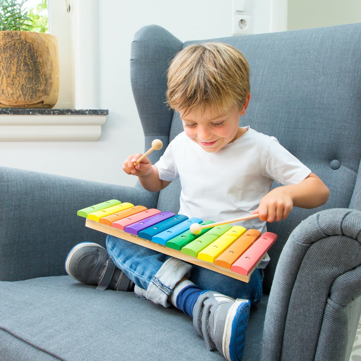 New Classic Toys Rainbow Xylophone | Musical Toy | Wooden Toddler Activity Toy | Lifestyle – Boy Playing | BeoVERDE.ie