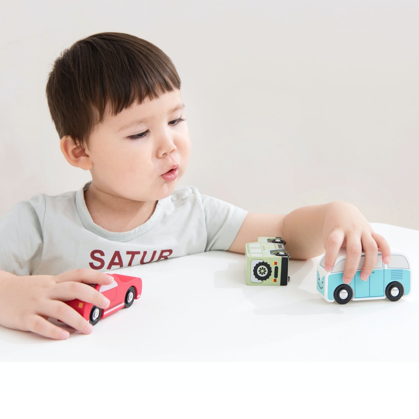 New Classic Toys Wooden Shape Sorter Truck | Baby & Toddler Activity Wooden Toy | Lifestyle - Boy Playing on Table | BeoVERDE.ie