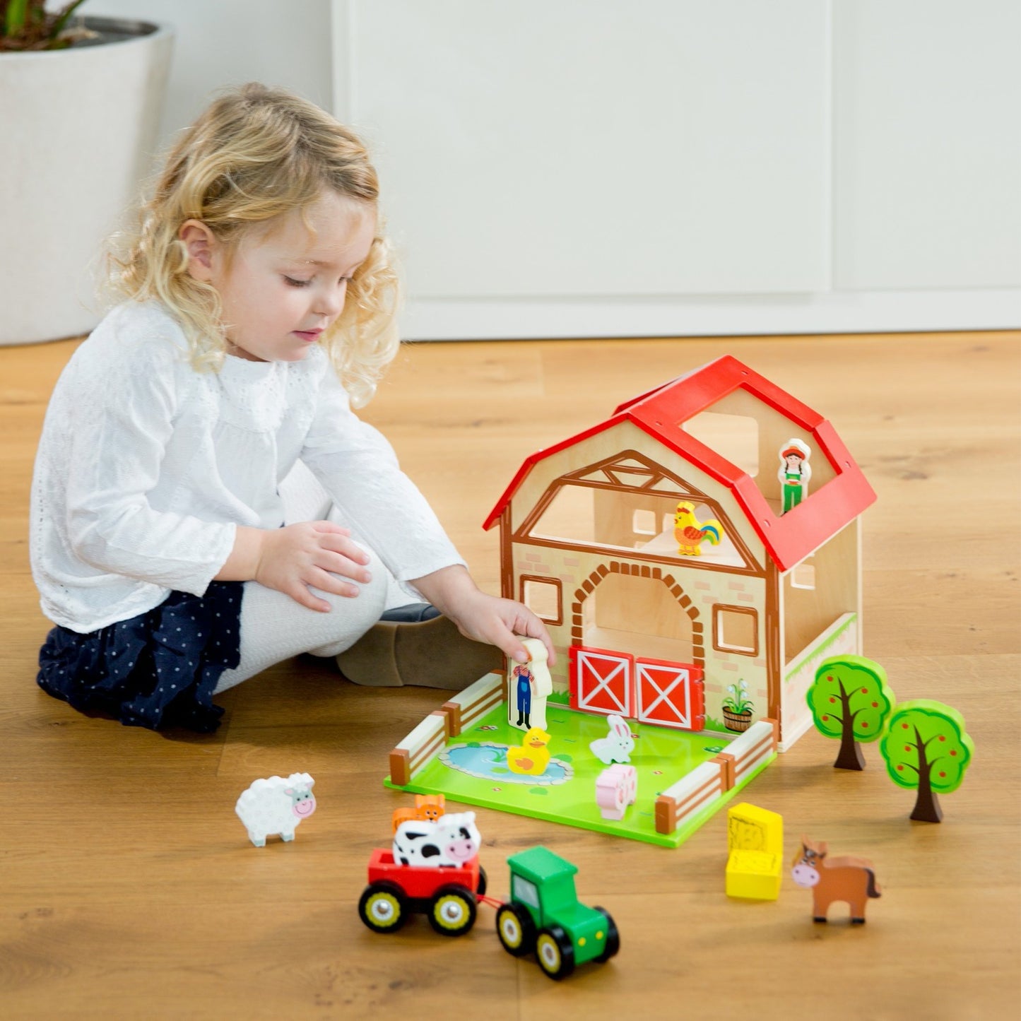 New Classic Wooden Toy Farm Play Set | Imaginative Play Toys | Lifestyle – Girl Playing with Wooden Figure | BeoVERDE.ie
