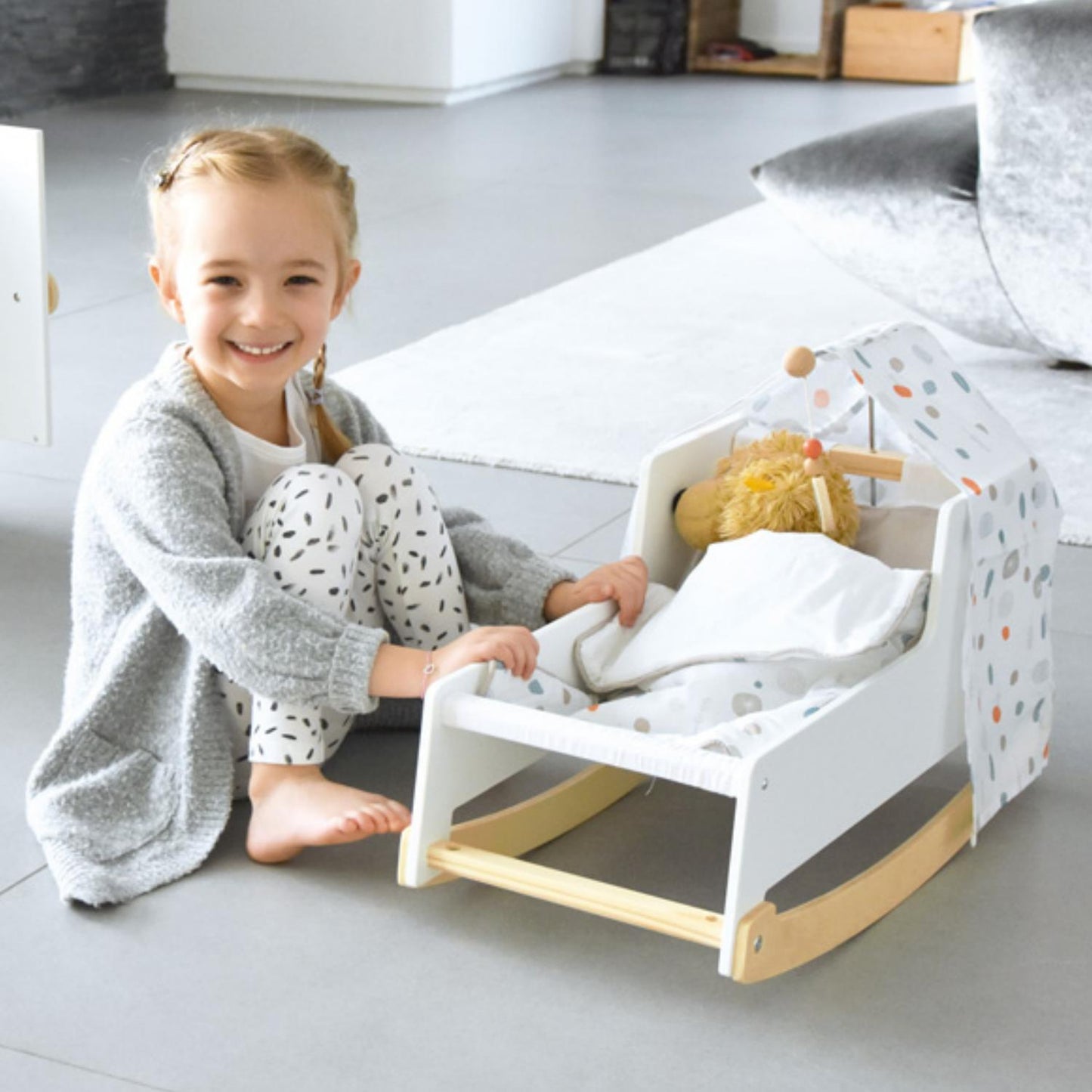 Small Foot Rocking Doll Cot | Wooden Pretend Play Toy for Kids | Lifestyle: Girl Playing with Doll’s Rocking Crib | BeoVERDE.ie