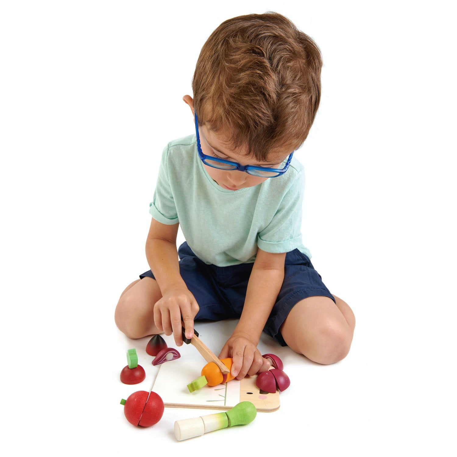 Tender Leaf Toys Mini Chef Chopping Board | Wooden Play Food & Kitchen Toys | Lifestyle – Boy Playing | BeoVERDE.ie