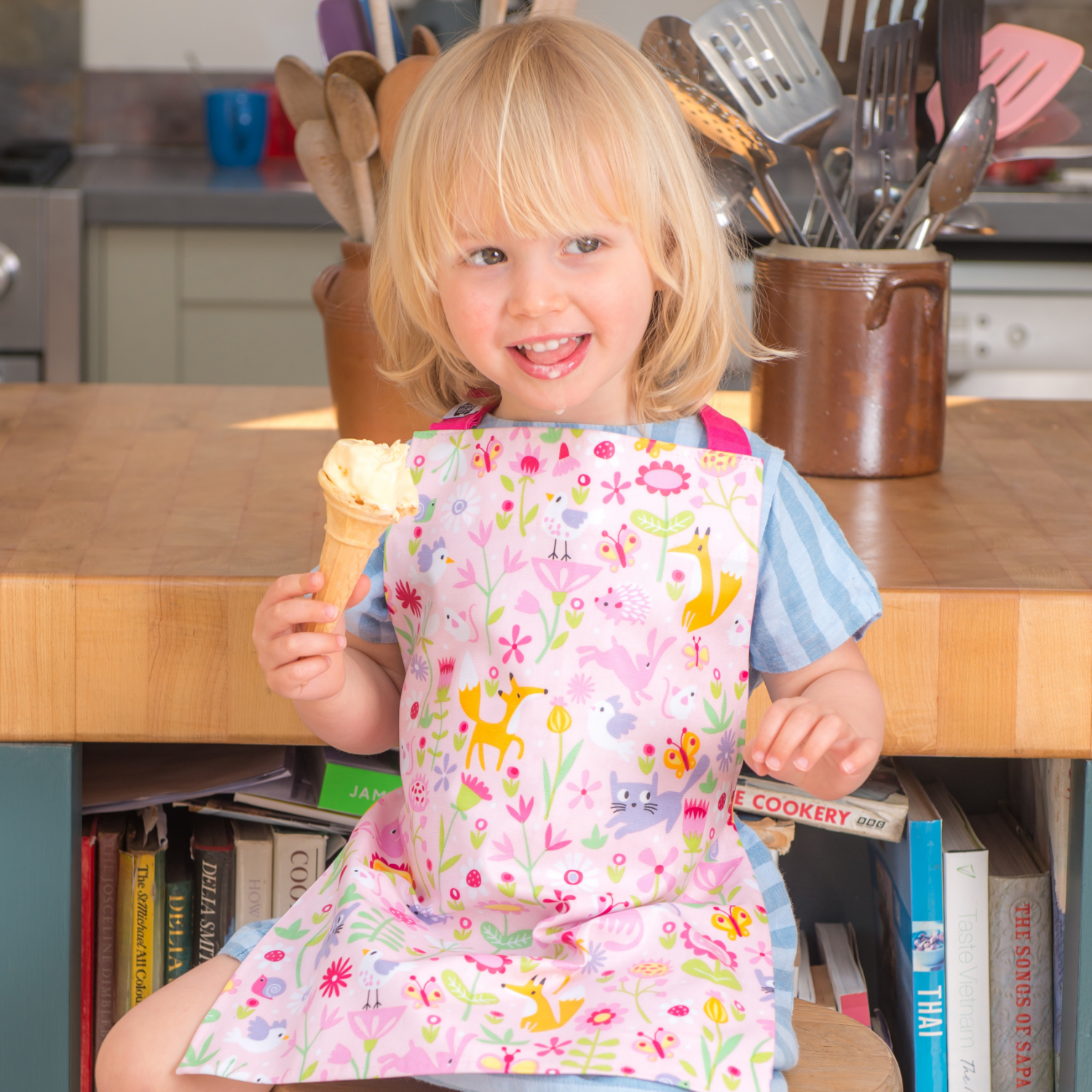 ThreadBear Design Children’s Apron ‘Flora's Garden’ | Girl Wearing Apron And Eating Ice Cream| BeoVERDE.ie