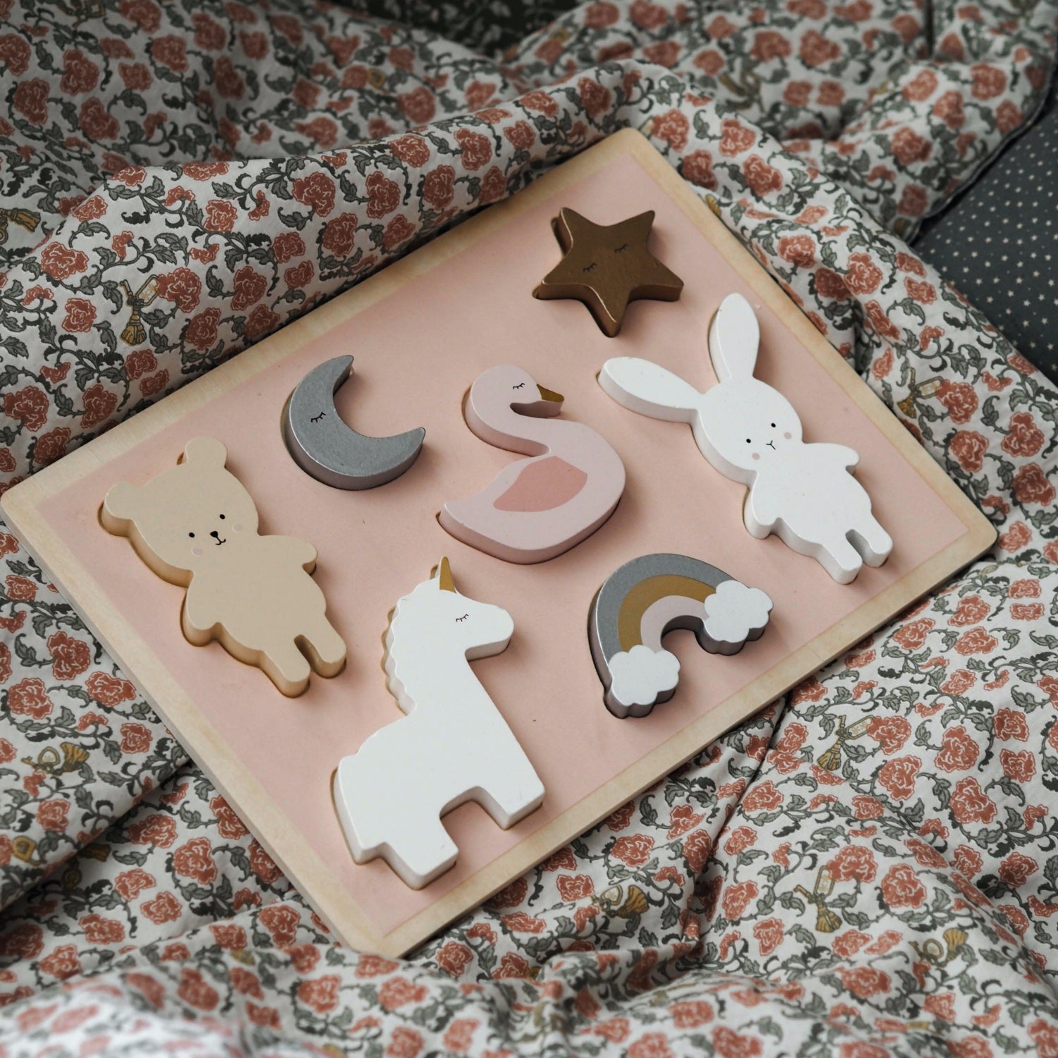 JaBaDaBaDo Unicorn Puzzle With 7 Different Pieces | Wooden Toddler Activity Toy | Front View – Lifestyle – On Bed | BeoVERDE.ie
