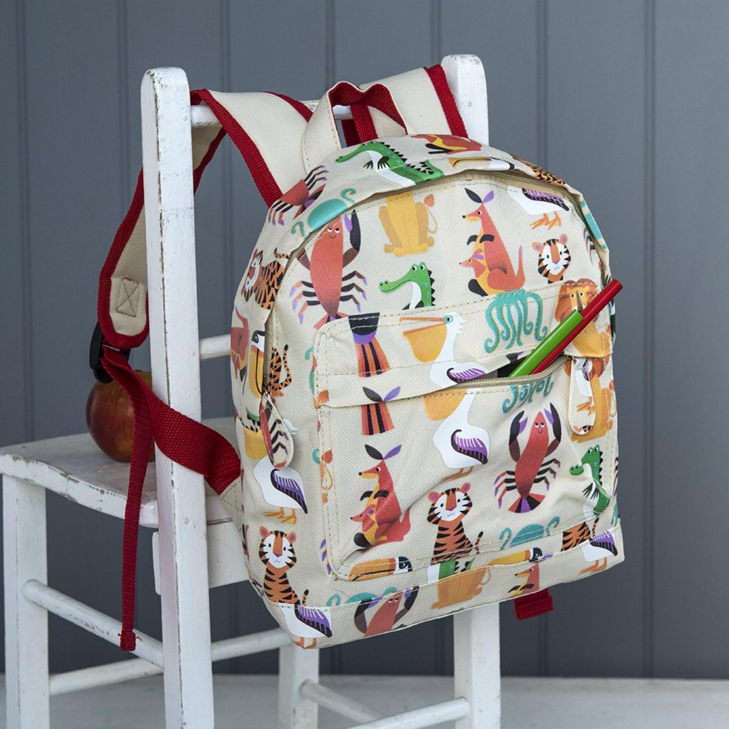 Rex London Colourful Creatures Mini Backpack | Kid’s Backpack for Creche, Nursery & School | Lifestyle: Backpack on Chair | BeoVERDE.ie