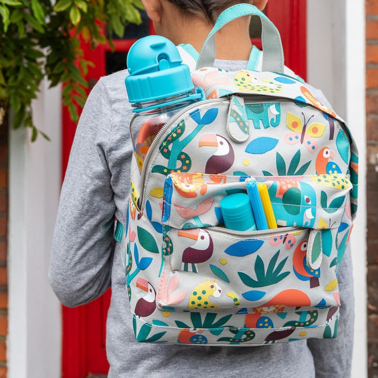 Rex London Wild Wonders Mini Backpack | Kid’s Backpack for Creche, Nursery & School | Lifestyle: Backpack on Chair | BeoVERDE.ie