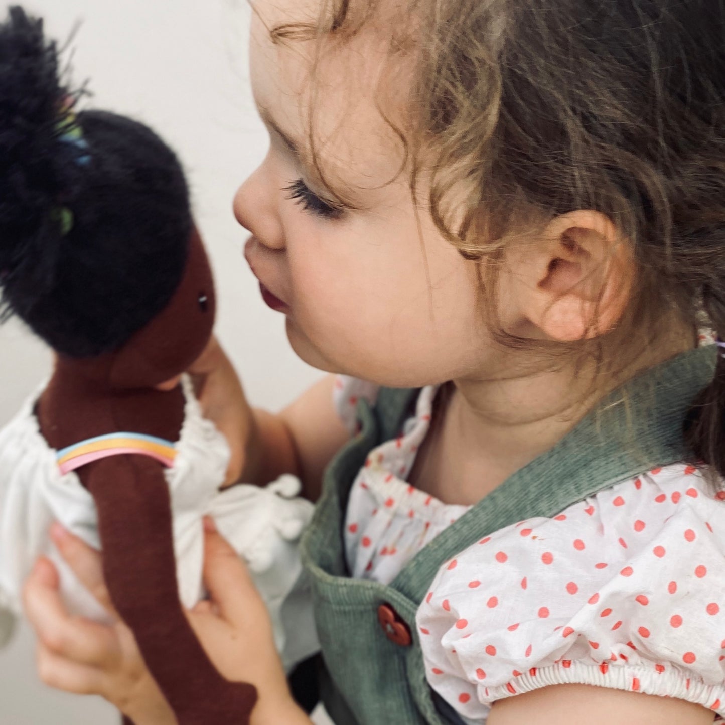ThreadBear Design Esme Rainbow Rag Doll | Hand-Crafted Rag Doll | Soft Cotton Children’s Doll | Lifestyle – Girl Kissing Rag Doll Esme | BeoVERDE.ie