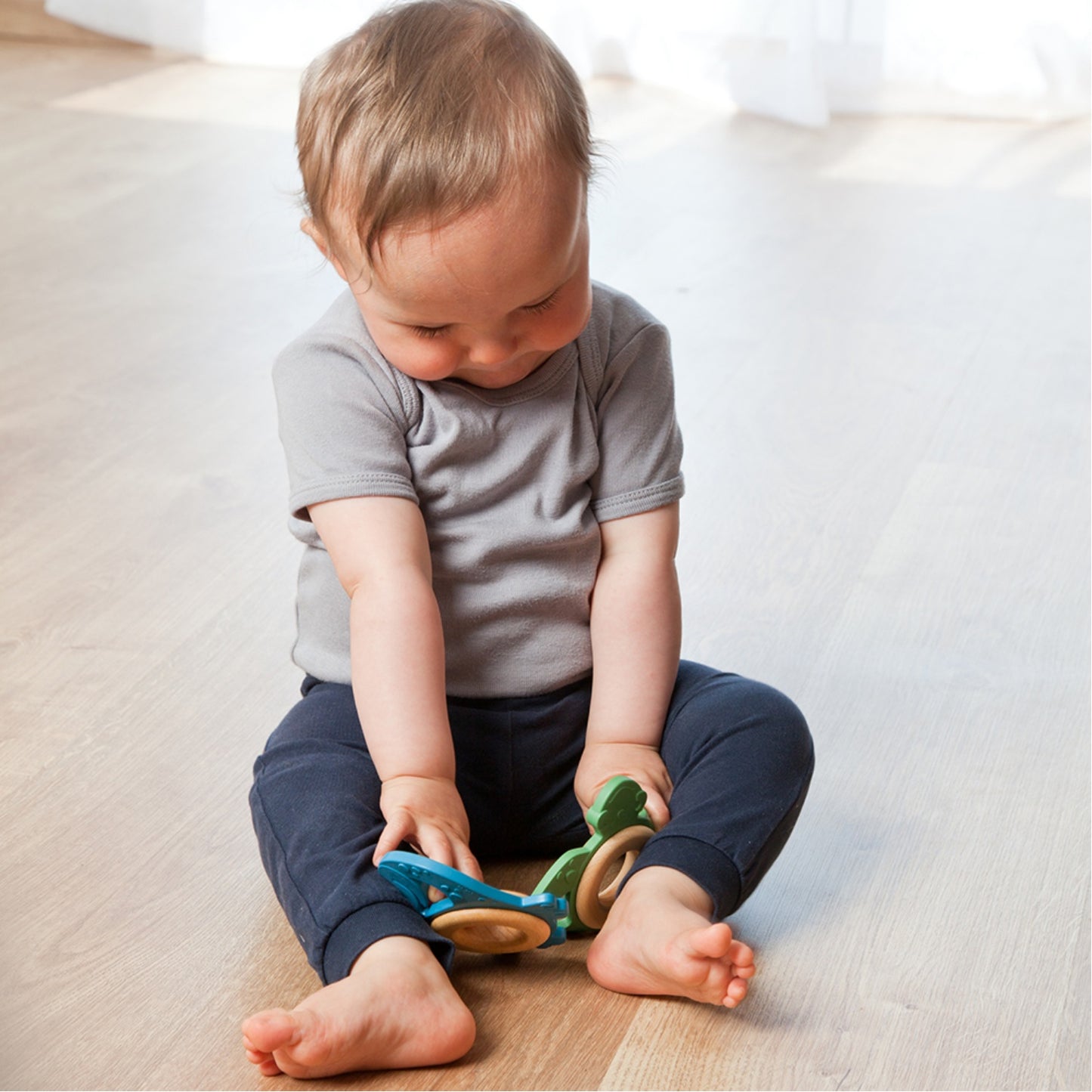 Grunspecht Turtle Organic Rubber Baby Teether | Lifestyle: Baby with 2 Teething Toys | BeoVERDE Ireland