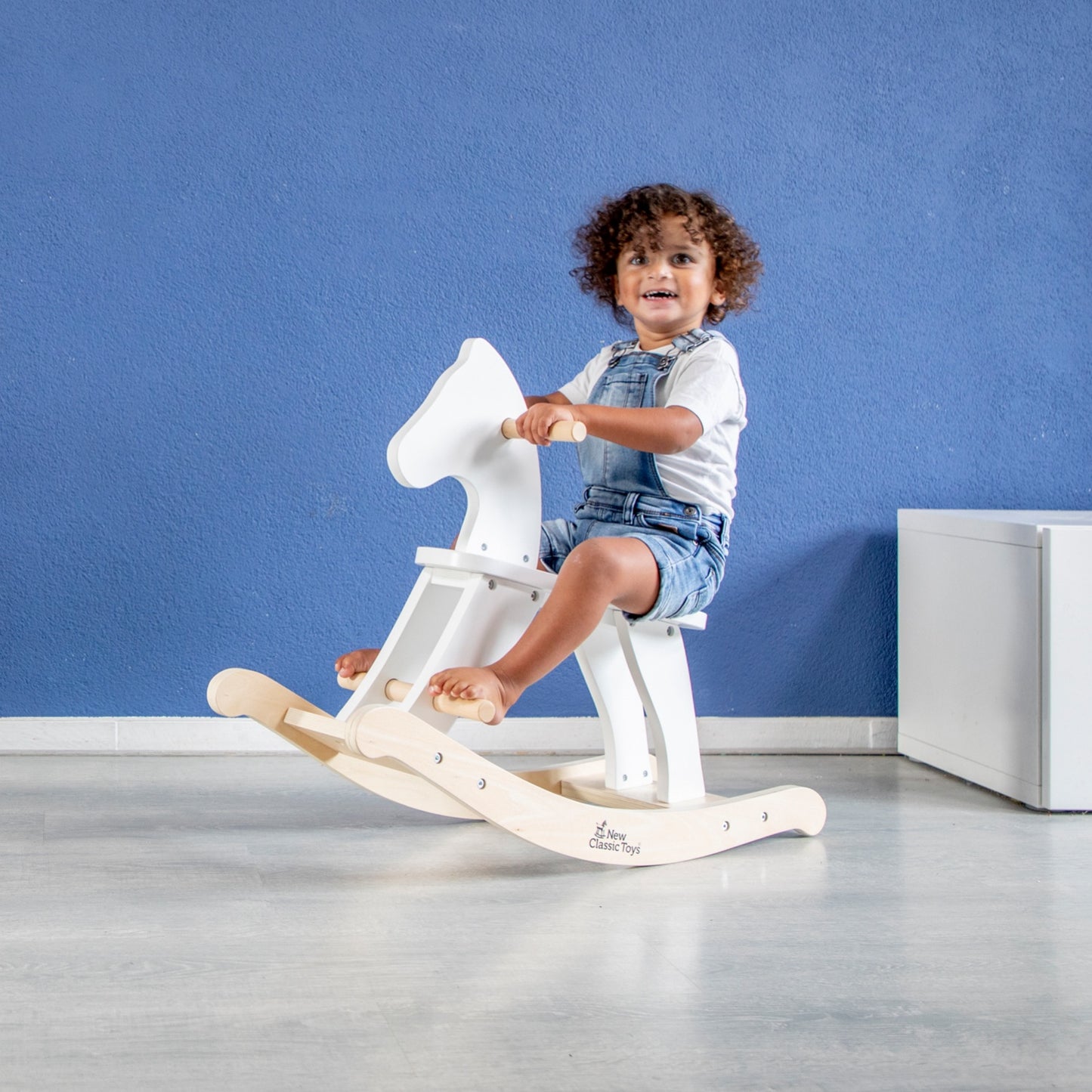 New Classic Toys Wooden Rocking Horse | White | Toddler Activity Wooden Toy | Lifestyle – Child Riding Horse | BeoVERDE Ireland