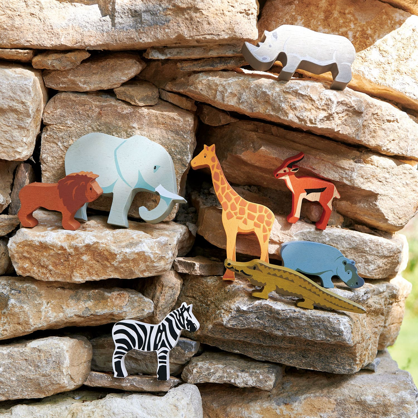 Tender Leaf Safari Animals | Hand-Crafted Wooden Animal | Outside Wooden Safari Animals On Stone Wall | BeoVERDE.ie