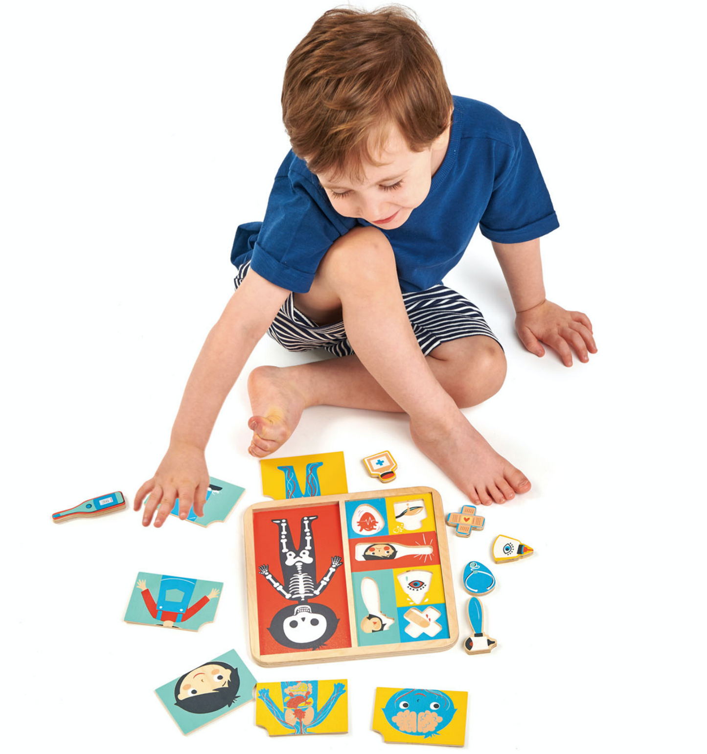 Tender Leaf Ouch Puzzle | Hand-Crafted Wooden Educational Toy | Boy Playing | BeoVERDE.ie