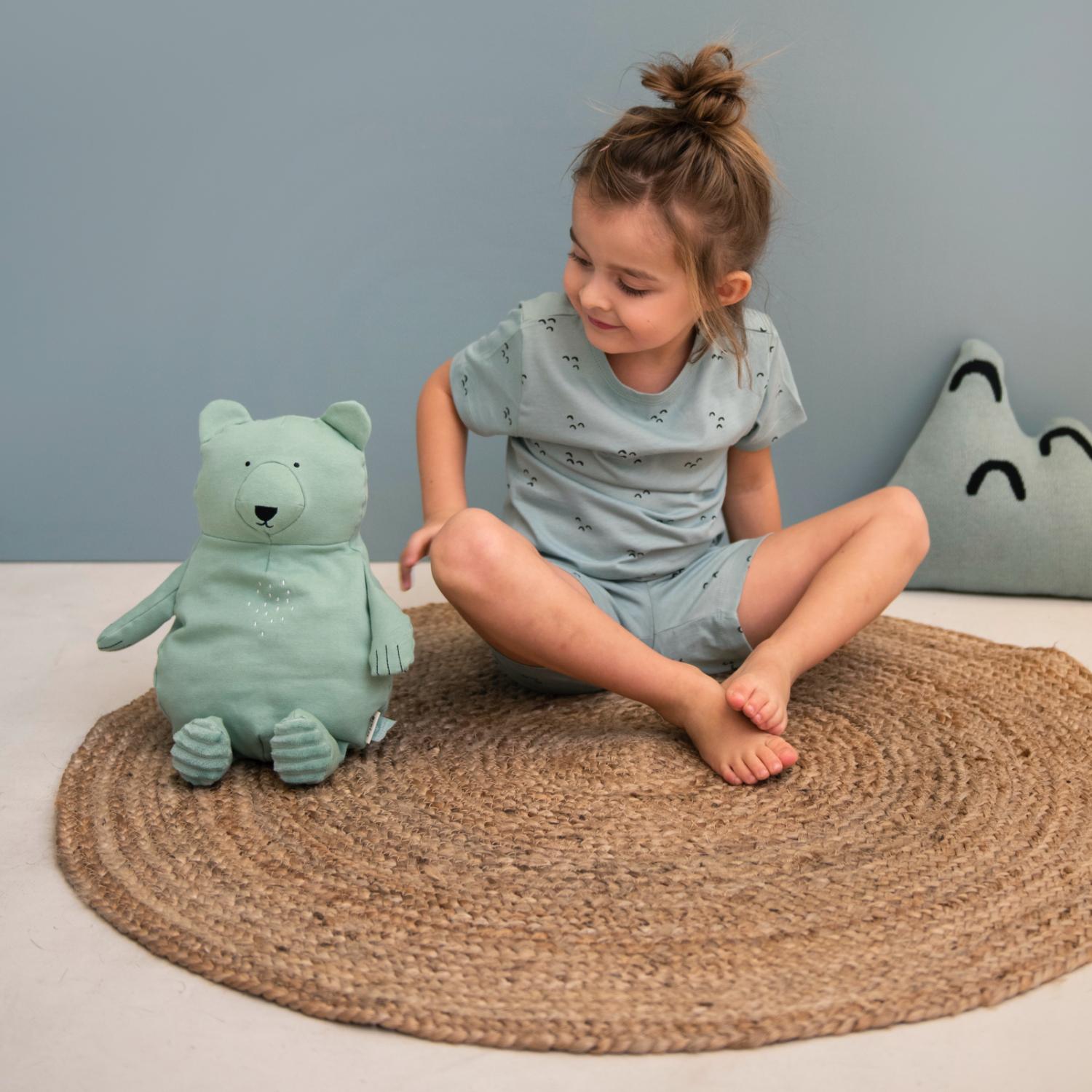 Trixie Mr. Polar Bear | Organic Plush Toy | Lifestyle – Girl Sitting with Mr. Polar Bear on Floor | Organic Plush Toy | BeoVERDE.ie