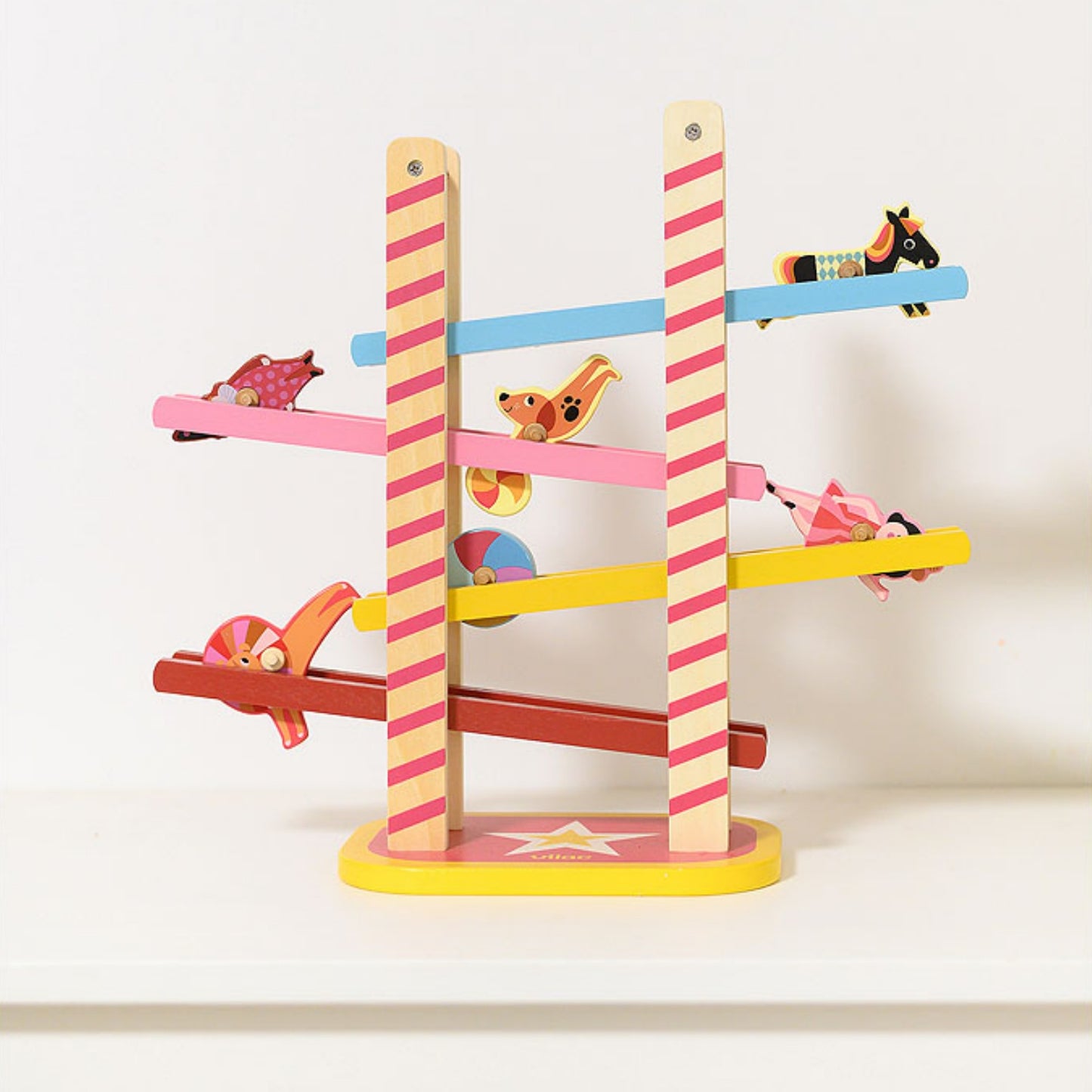 Vilac Acrobat's Cascade designed by Ingela P.Arrhenius | Wooden Toddler Activity Toy | Lifestyle - Side View  - Figures Rolling | BeoVERDE.ie