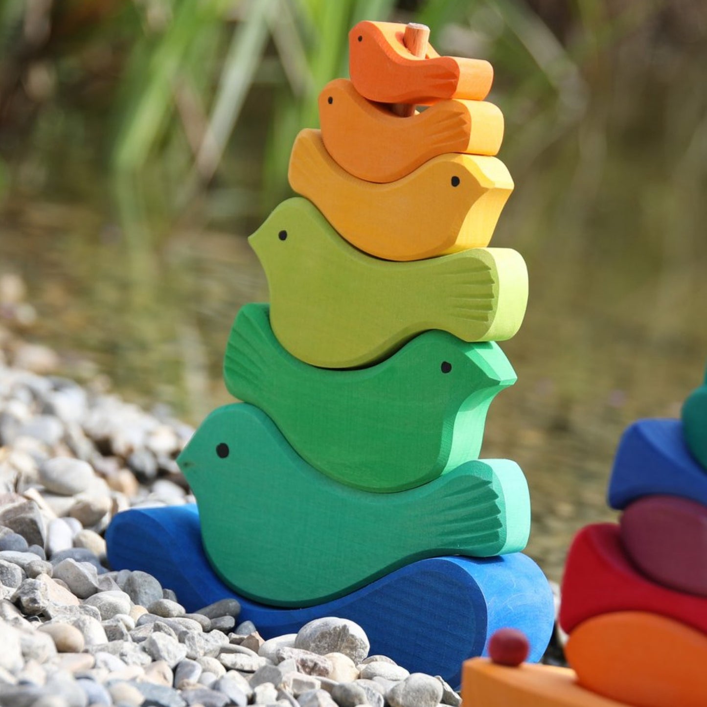 Gluckskafer Wooden Bird Stacker | Imaginative Play Wooden Toys | Waldorf Education and Montessori Education | Lifestyle: Side View –Bird Stacker in Garden | BeoVERDE.ie