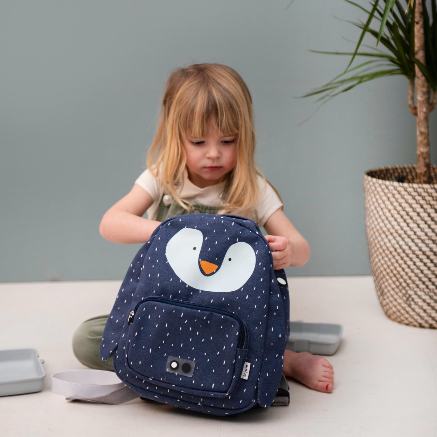 Trixie Mr. Penguin Backpack | Kid’s Backpack for Creche, Nursery & School | Lifestyle: Girl Packing Backpack | BeoVERDE.ie