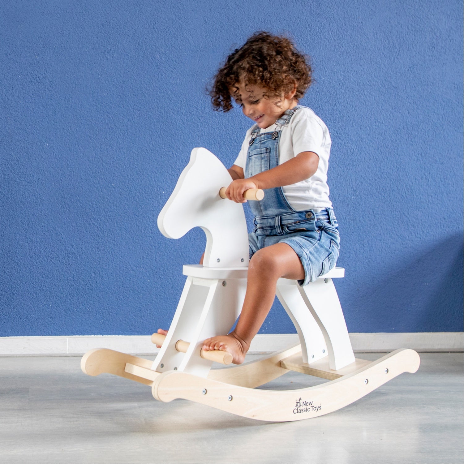 New Classic Toys Wooden Rocking Horse | White | Toddler Activity Wooden Toy | Lifestyle – Child Riding Horse | BeoVERDE Ireland