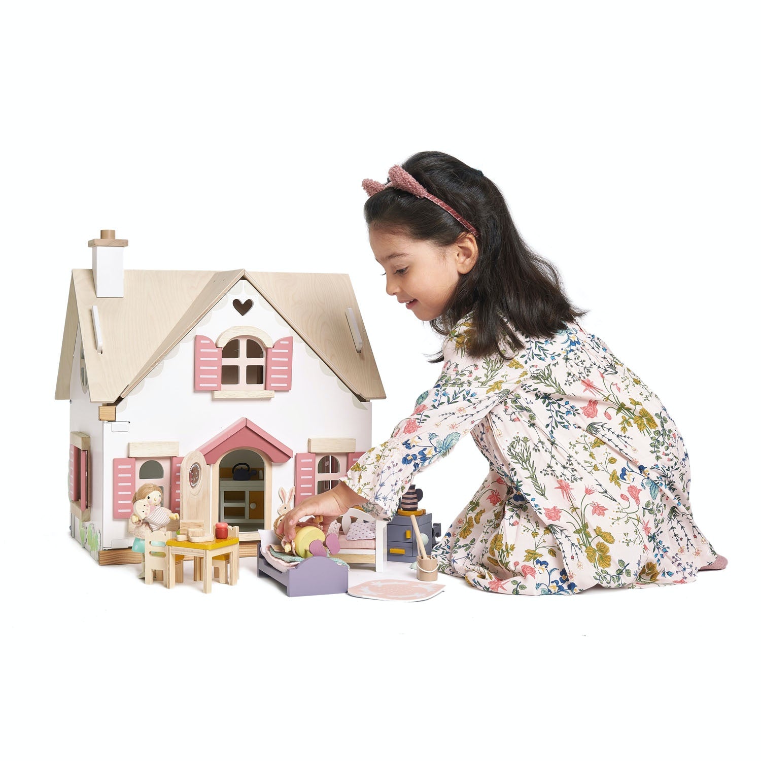 Tender Leaf Toys Cottontail Cottage | Wooden Doll's House Including Furniture | Lifestyle – Girl Playing Outside House | BeoVERDE.ie
