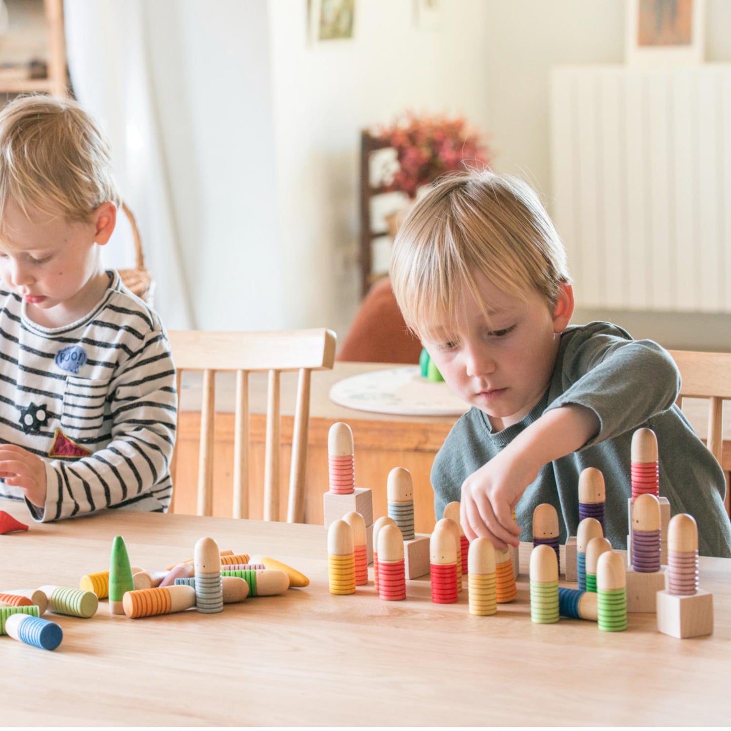 Grapat Brots | Wooden Toys for Kids | Open-Ended Play Set | Lifestyle: Boy Playing with Grapat Brots on Table | BeoVERDE.ie