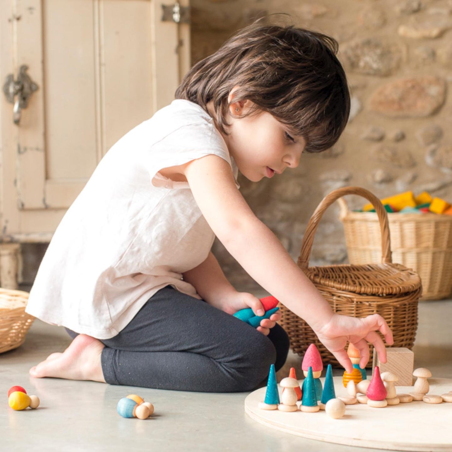 Grapat Nins Tomten | Wooden Toys | Open-Ended Play Set | Lifestyle: Boy Playing with Grapat Nins Tomten on Floor | BeoVERDE.ie