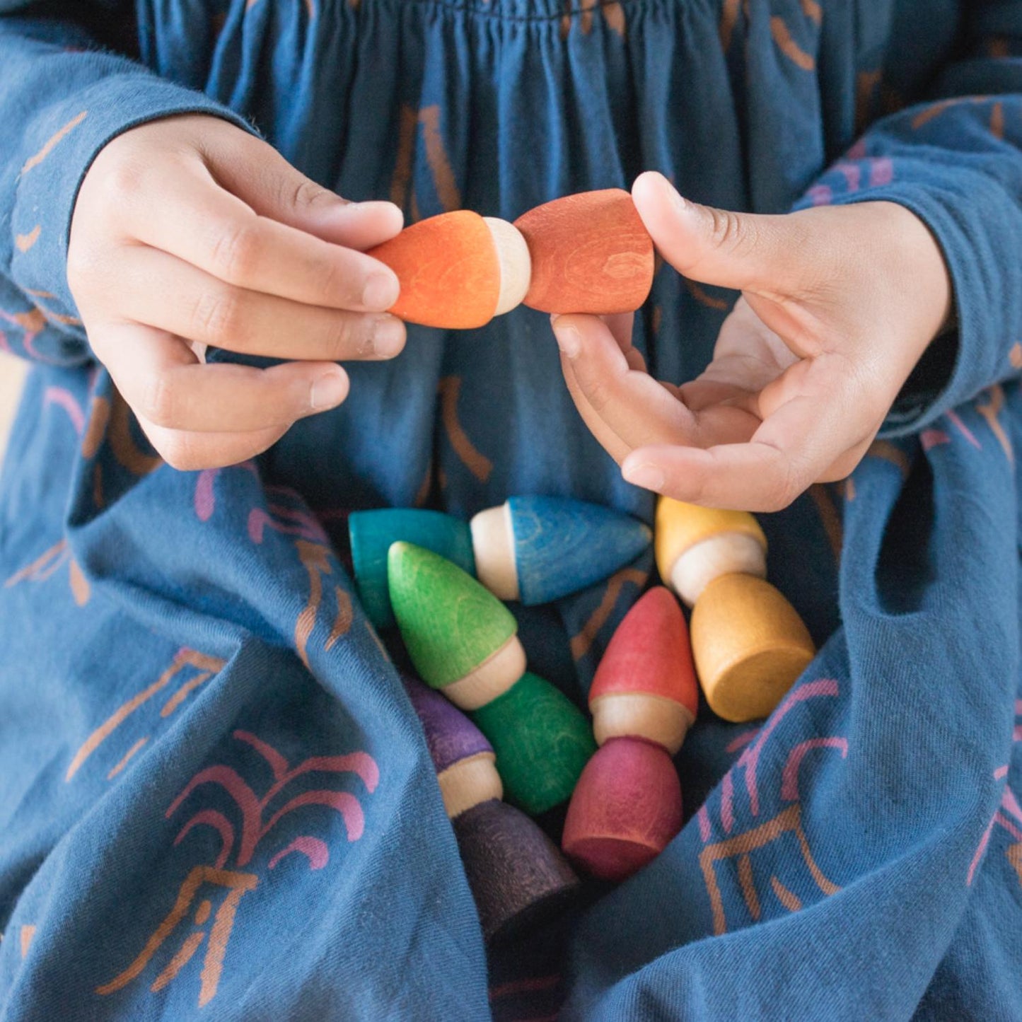 Grapat Rainbow Tomtens | Wooden Toys | Open-Ended Play Set | Lifestyle: Girl Holding Grapat Rainbow Tomtens | BeoVERDE.ie